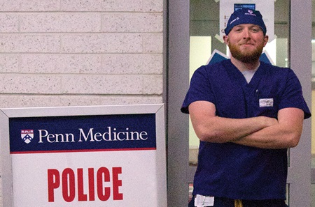 James Glatts, BSN, CEN, standing near Emergency Department entrance